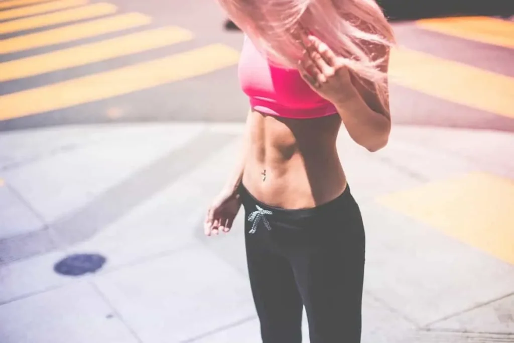 Woman with toned stomach after LA-EMS Body Sculpting Treatment King's Cross