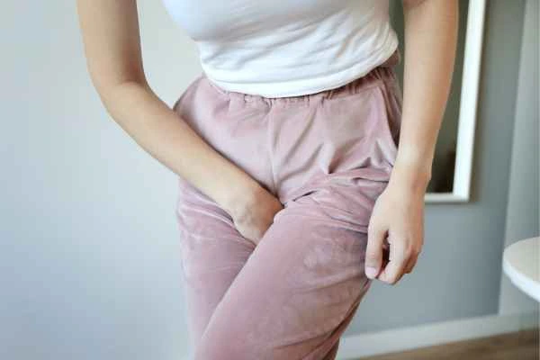 woman running for the toilet because of urinary incontinence King's Cross